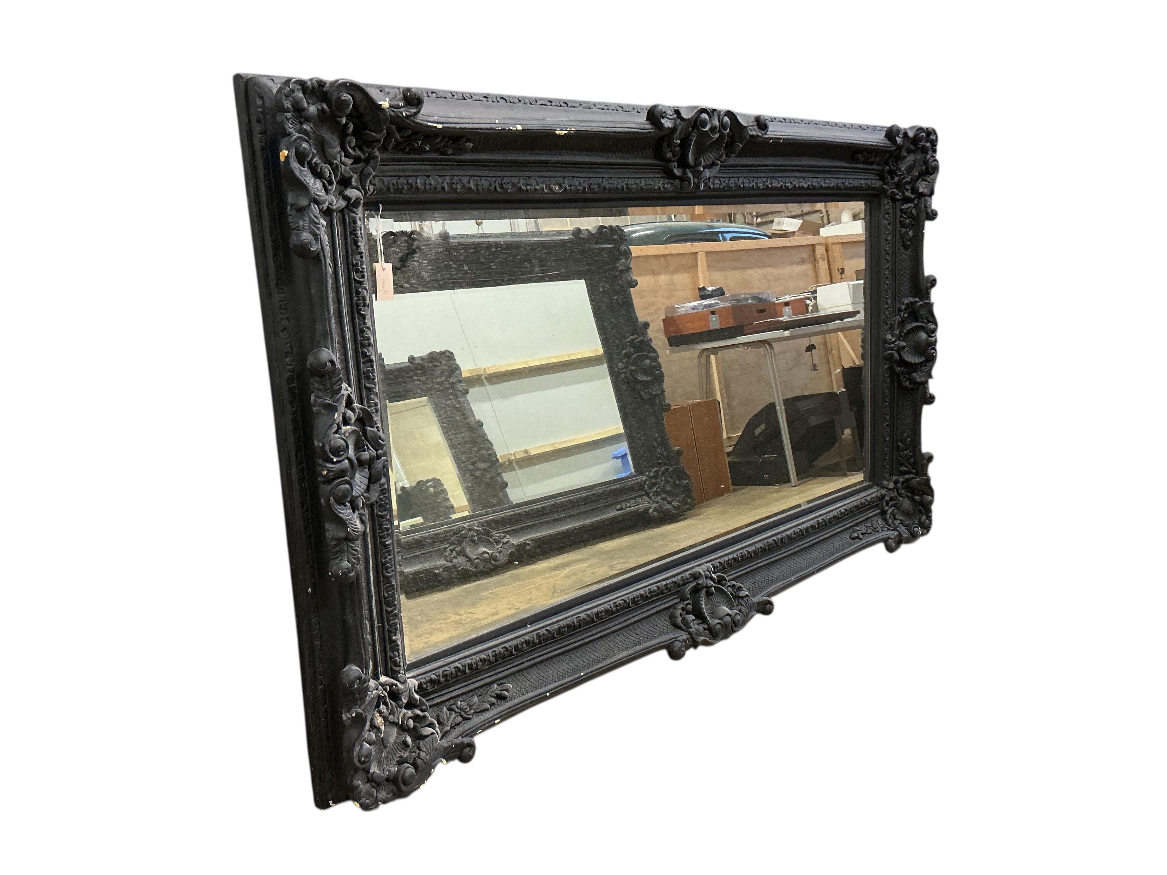 A large Victorian style 'Heritage' rectangular black painted wall mirror, width 226cm, height 136cm